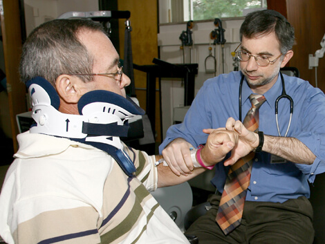 patient with a spinal cord injury wearing a neckbrace