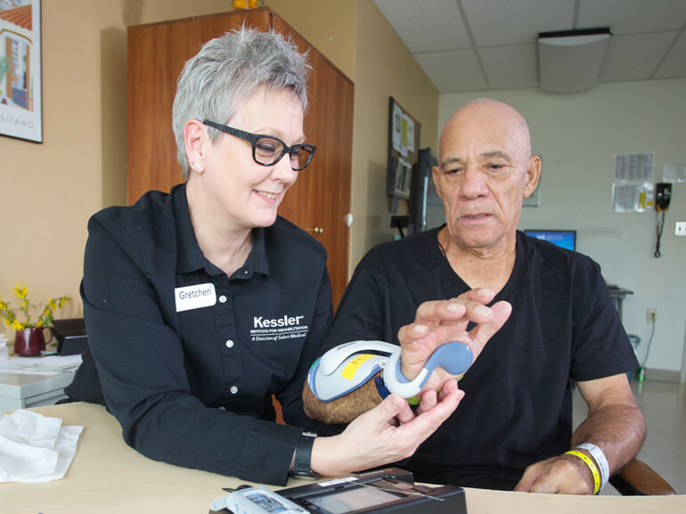 stroke patient working with physical therapist