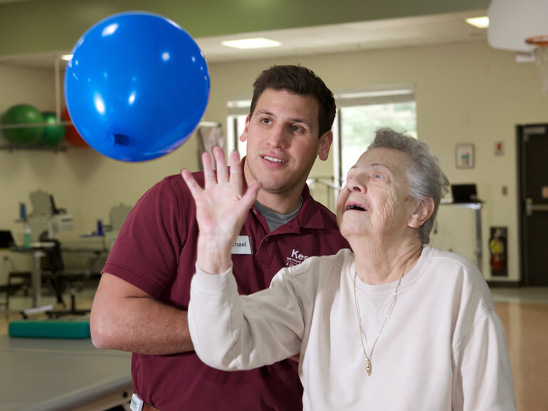 neurologic patient working with physical therapist