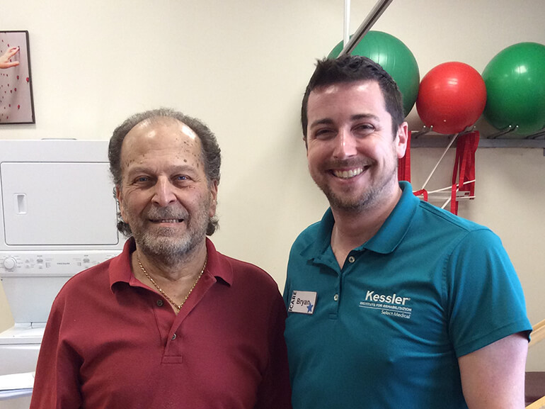 Orlando Dinnocenzio standing next to his physical therapist at Kessler Institute for Rehab