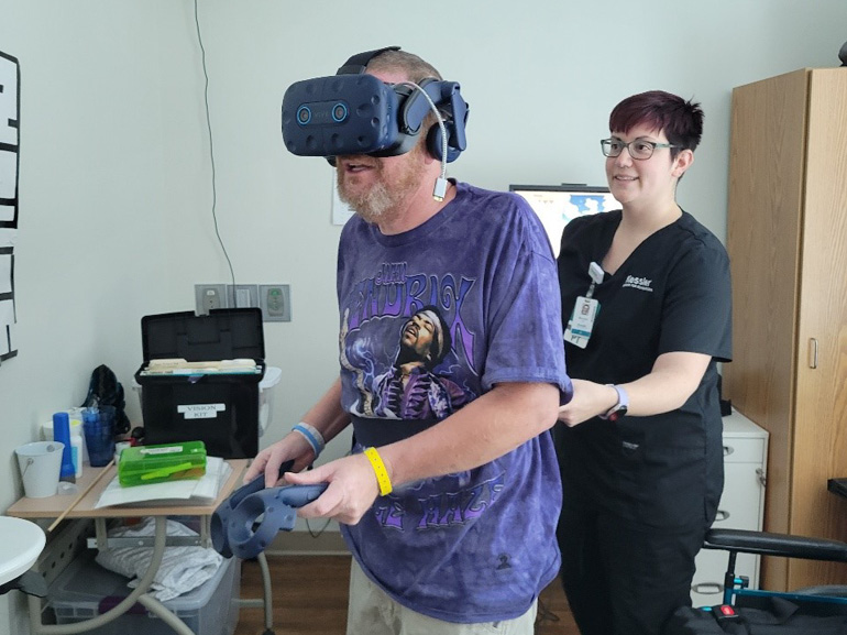 Howard Webb at Kessler Institute for Rehabilitation using virtual reality technology in his therapy. 