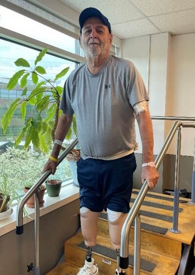 Photo of Marc Cleaver practicing steps at Kessler Institute for Rehabilitation. 