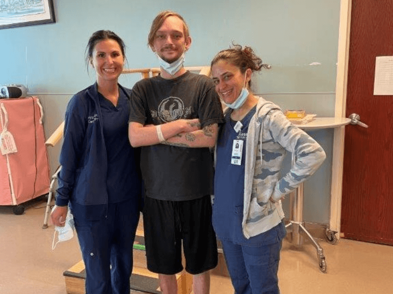 Patient smiling with therapists
