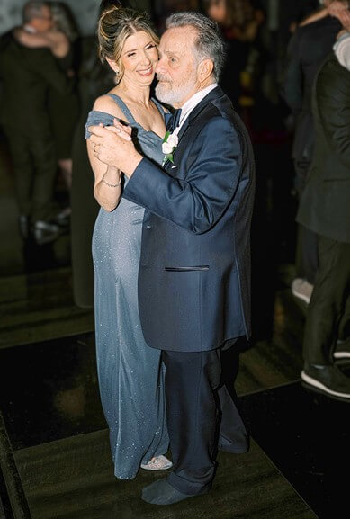 Photo of Warren Leary and his wife Lisa dancing at their son's wedding. 