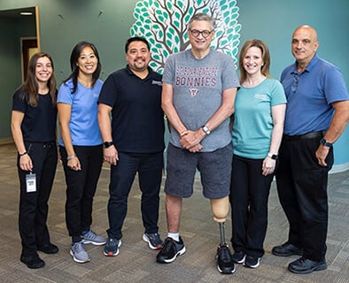 Mike Vaccaro standing with the Kessler Team